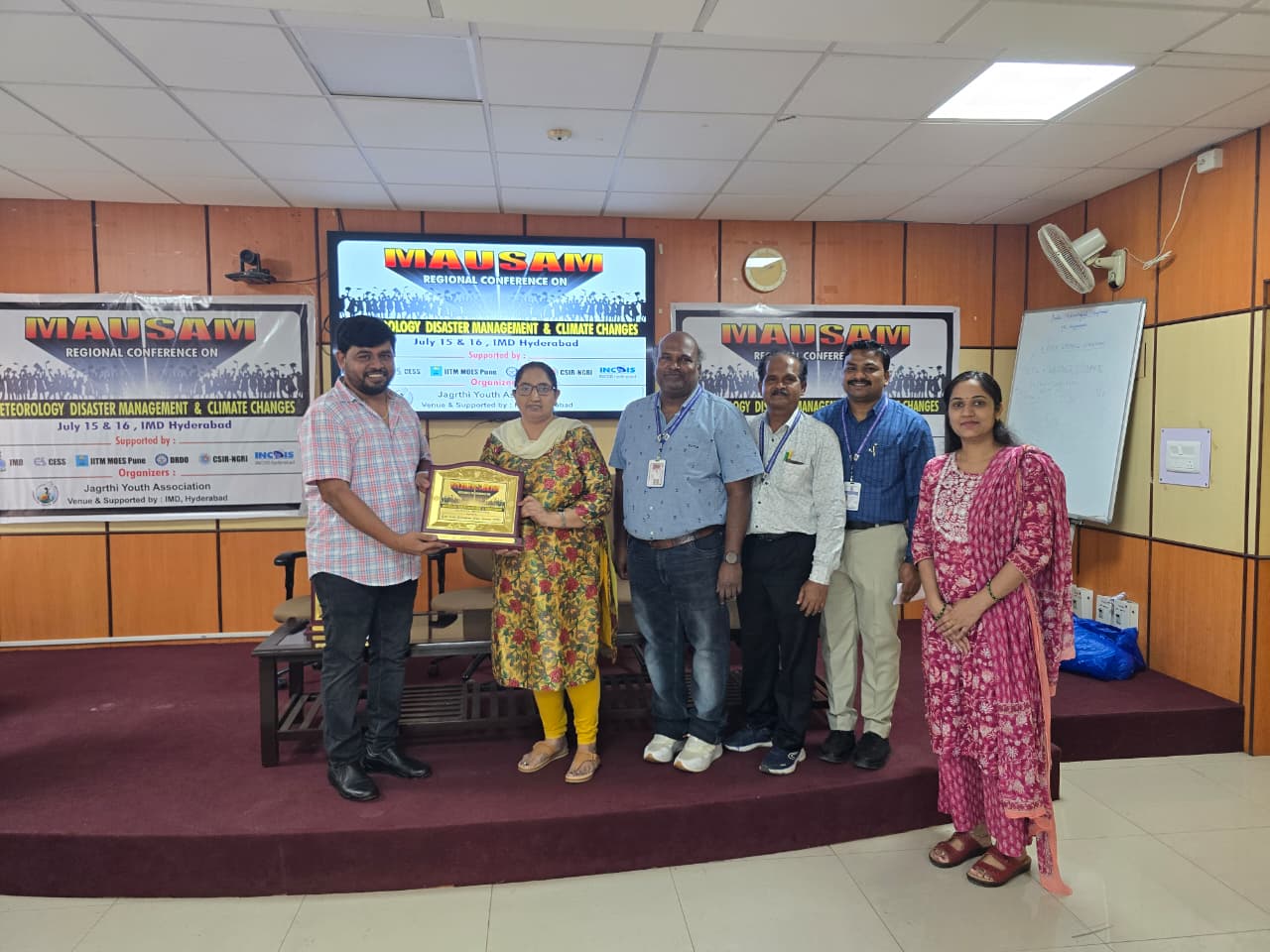 Jagruthi and IMD representatives presenting a memento during MAUSAM 2025