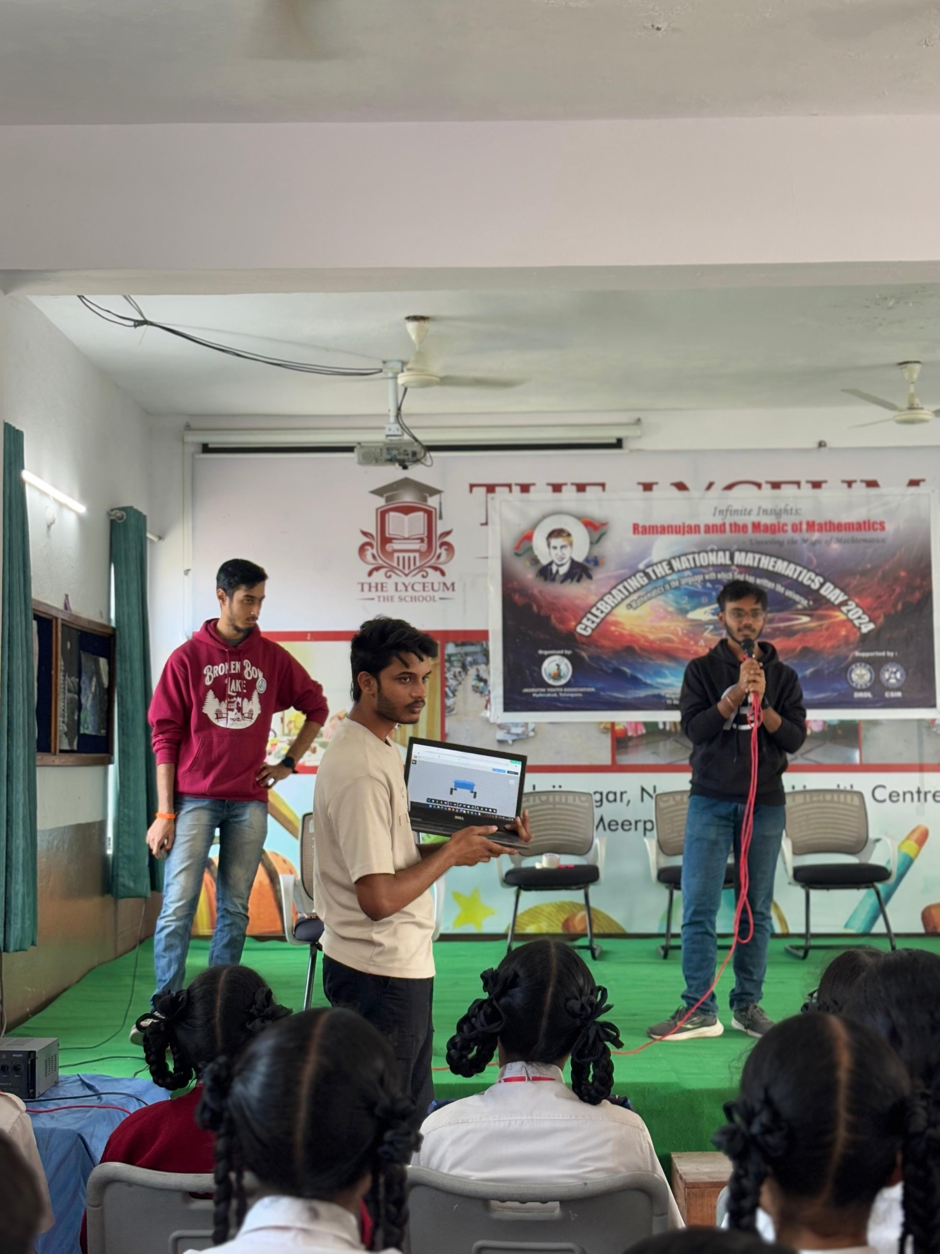 Students presenting a technology demonstration