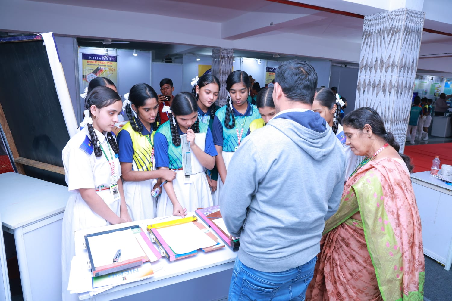 Students exploring a demonstration at Bharat Pride 2024