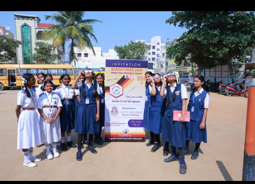 Students beside the Bharat Pride 2024 invitation display